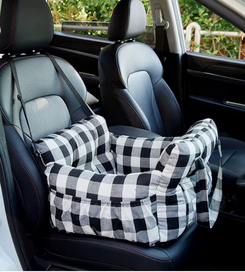 Dog car booster seat with small dog seated inside